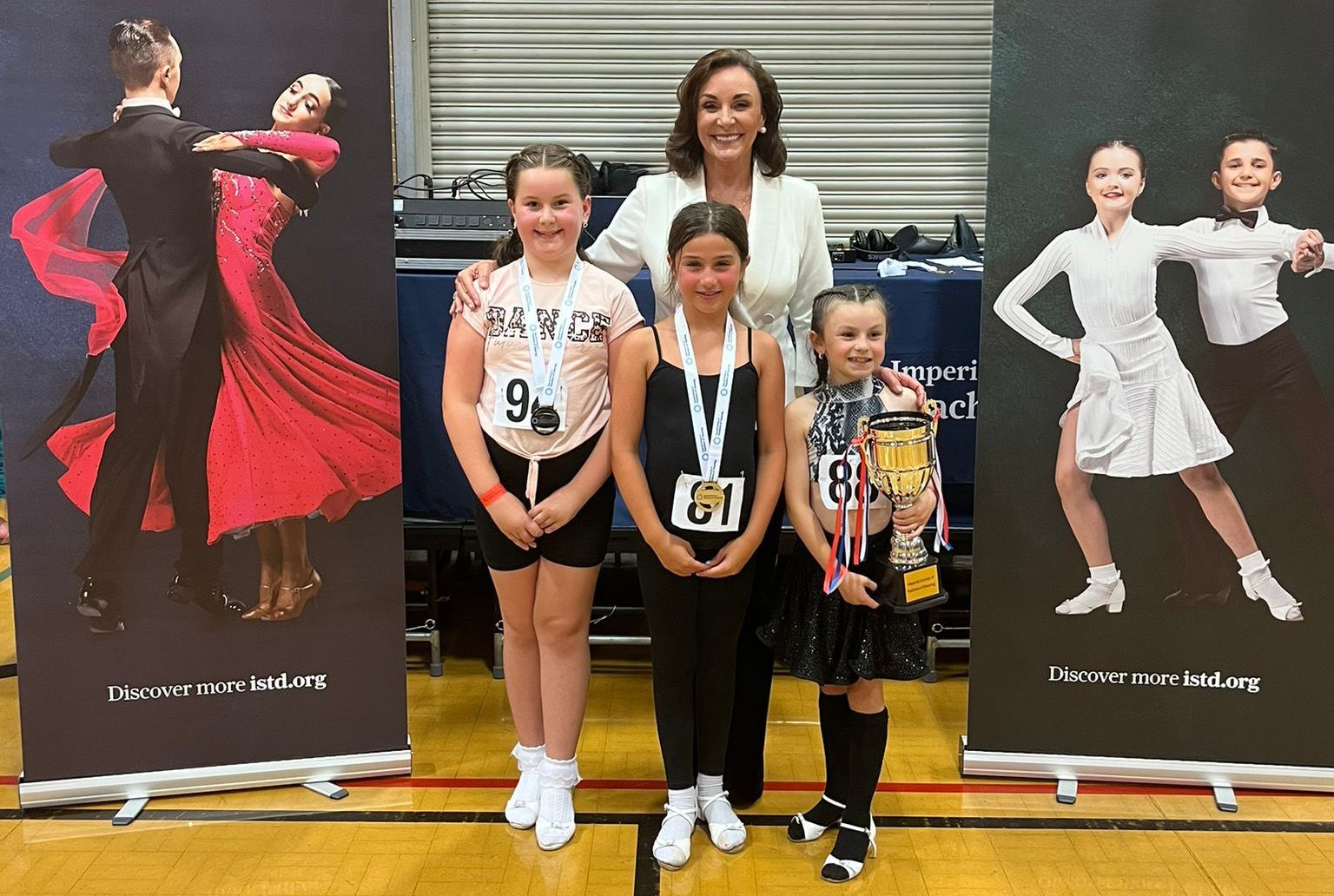Shirley Ballas presenting the ISTD President's Cup to finalists (Juvenile)